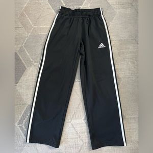 Adidas boys wide leg track pant with drawstring and pockets.